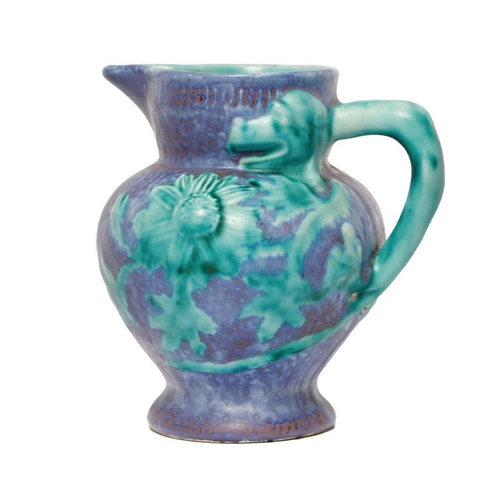 121 - Inspiration by Clarice Cliff jug in the form of a Dragon, mottled glaze effect, 18.5cm tall.