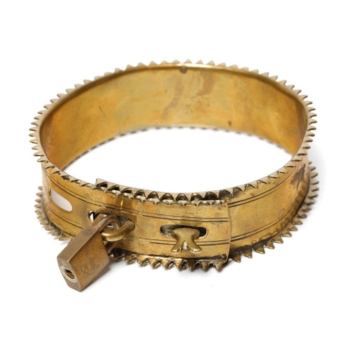 263 - An antique brass dog collar with decorative fixings and raised spiked pattern to outer edge. Diamete... 