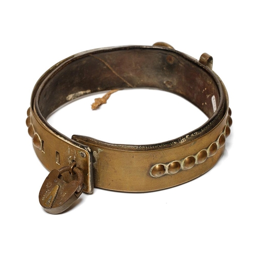 264 - An antique brass dog collar with ball decoration, sliding buckle and original leather insert. Period... 