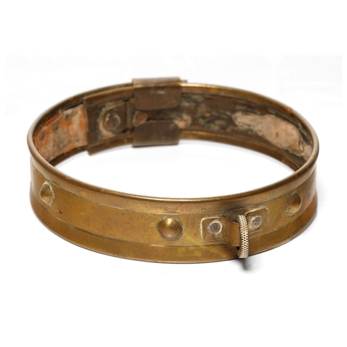 265 - An antique brass dog collar with ball decoration and sliding buckle.  Diameter 46cm.