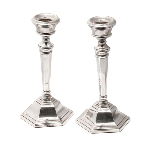 404 - A pair of loaded silver candlesticks, hallmarked S&M, Birmingham, 1970. Height 15.5cm. Gross weight ... 