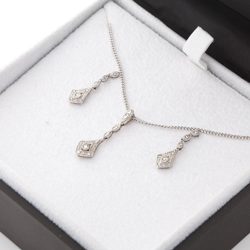 457 - 9ct white gold jewellery set to include a pair of earrings with a pendant and chain, all diamond set... 