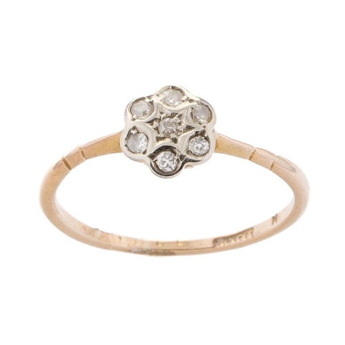 467 - 18ct gold diamond daisy ring, 1.5 grams, Chester 1910, size O.