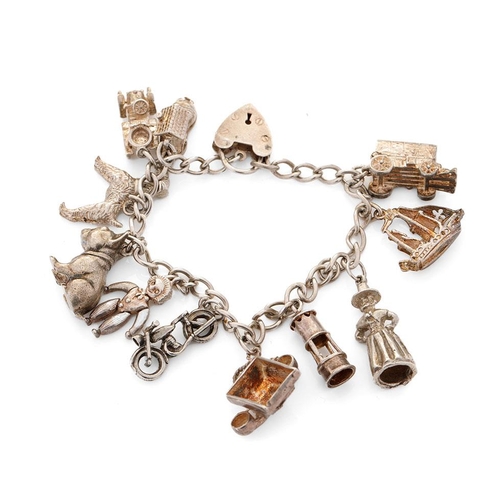 468 - Silver charm bracelet with charms to include an Airedale terrier, a bulldog, a galleon and others, 5... 