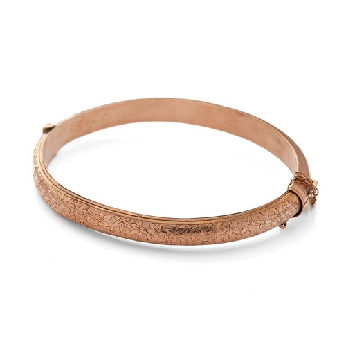 480 - 9ct rose gold hollow bangle with engraved decoration, 8.7 grams.