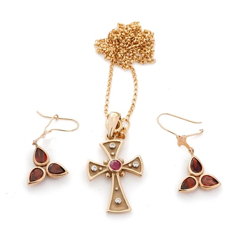 502 - A 9ct yellow gold cross pendant marked .375 set with a ruby and four diamonds, on a 9ct gold chain t... 