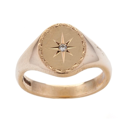 534 - 9ct gold gents ring set with diamond chip amongst star decoration, size X, 8.7 grams.