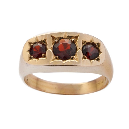 545 - 9ct gold gypsy ring set with 3 garnets, size Y/Z, 6.4 grams.