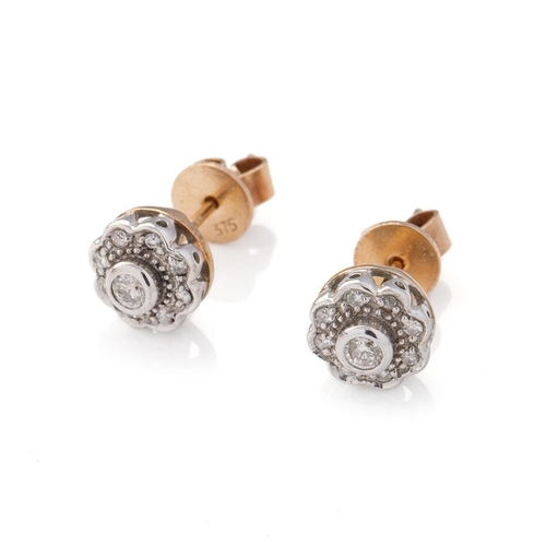 602 - Diamond and 9ct yellow gold daisy head earrings with white gold face and setting, containing a total... 