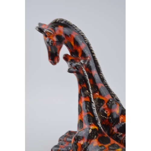 107 - Anita Harris Art Pottery pair of giraffes decorated in the Hot Coals pattern, 26cm tall.