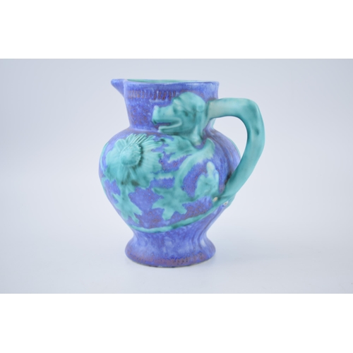 121 - Inspiration by Clarice Cliff jug in the form of a Dragon, mottled glaze effect, 18.5cm tall.