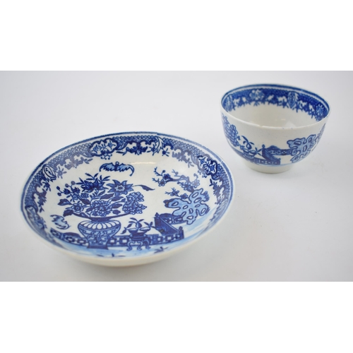 147 - A late 18th century blue and white transfer-printed porcelain Worcester Bat pattern tea bowl and sau... 