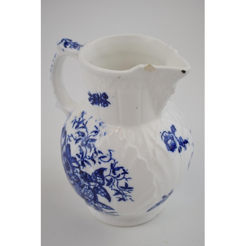 150 - A late 18th, early 19th century blue and white transfer-printed porcelain moulded mask jug decorated... 