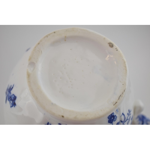 150 - A late 18th, early 19th century blue and white transfer-printed porcelain moulded mask jug decorated... 