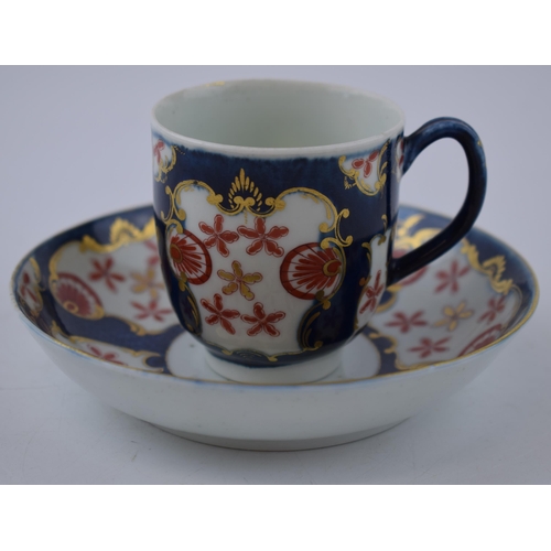 157 - An 18th century Worcester porcelain Japan Star pattern on a blue scale ground cup and saucer, c. 177... 