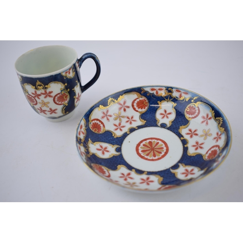 157 - An 18th century Worcester porcelain Japan Star pattern on a blue scale ground cup and saucer, c. 177... 