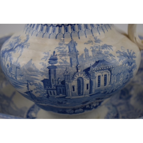 165 - An early 19th century blue and white transfer-printed Sicilian pattern jug and bowl, c. 1830. Bowl: ... 