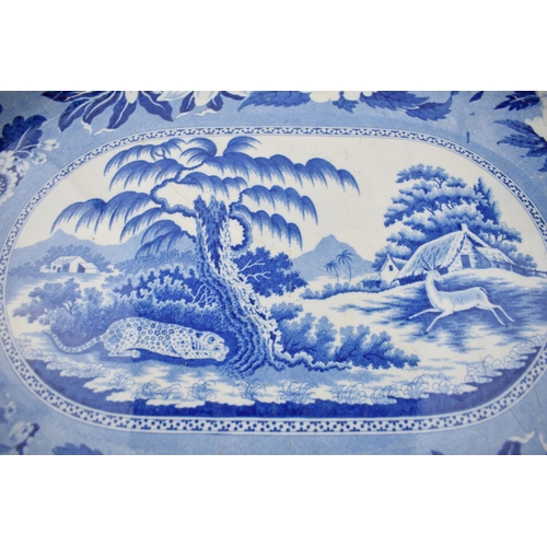 174 - An early 19th century blue and white transfer-printed Leopard and Antelope pattern large platter, c.... 