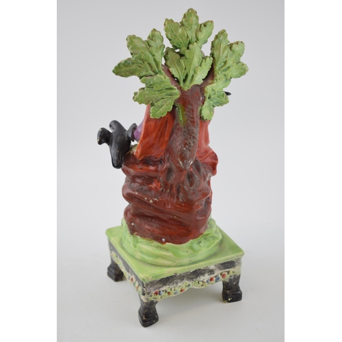 187 - An early 19th century Staffordshire pearlware bocage figure of Elijah on table base, c. 1820. 31 cm ... 