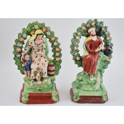 188 - A pair of early 19th century Staffordshire pearlware bocage figure of Elijah and the Widow, c. 1820.... 