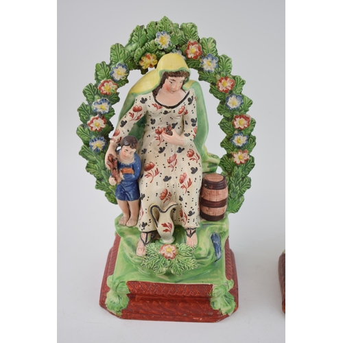 188 - A pair of early 19th century Staffordshire pearlware bocage figure of Elijah and the Widow, c. 1820.... 