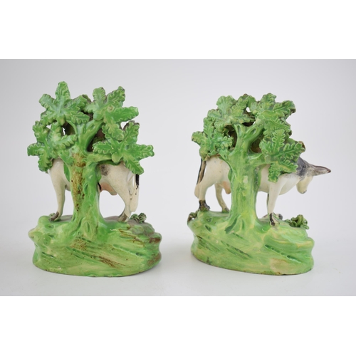 189 - A pair of early 19th century Staffordshire pearlware bocage figures of Cows and Calves, c. 1820. 14 ... 