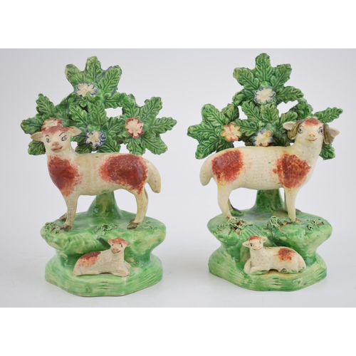 190 - A pair of early 19th century Staffordshire pearlware bocage figures of sheep with lambs, c. 1820.