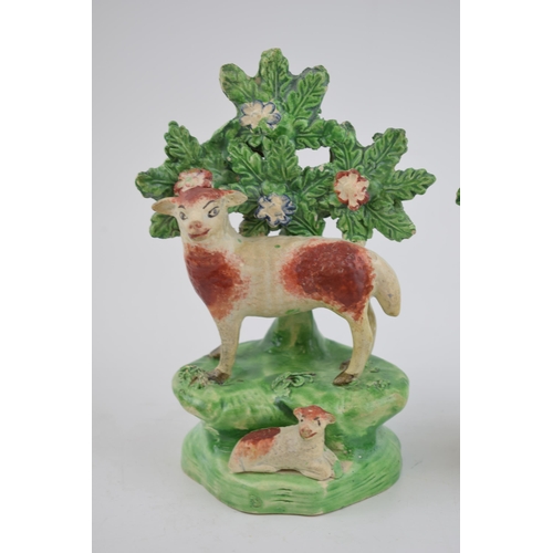 190 - A pair of early 19th century Staffordshire pearlware bocage figures of sheep with lambs, c. 1820.