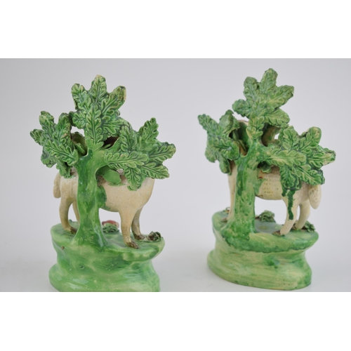 190 - A pair of early 19th century Staffordshire pearlware bocage figures of sheep with lambs, c. 1820.