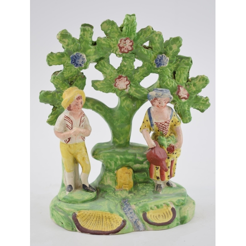 192 - An early 19th century Staffordshire pearlware bocage figure of lady and gentleman gardeners, c. 1820... 