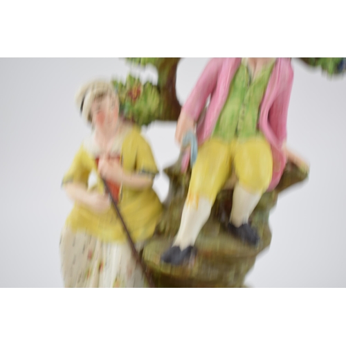 193 - An early 19th century Staffordshire pearlware bocage figure of boy and girl harvesters on square bas... 