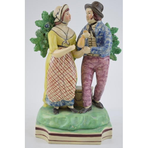 194 - An early 19th century Staffordshire pearlware bocage figure of the sailor’s return, c. 1820. 25 cm t... 