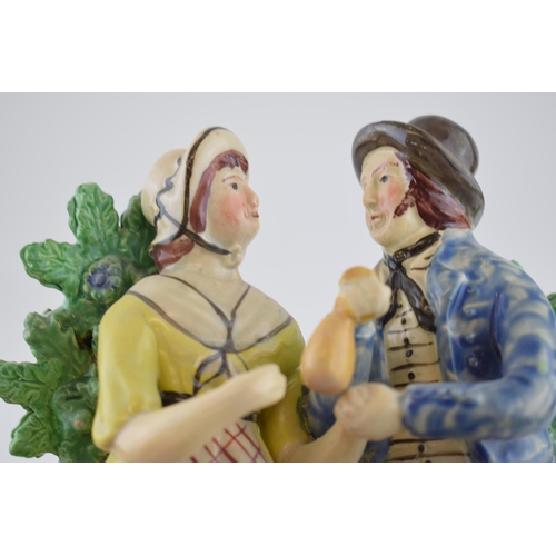 194 - An early 19th century Staffordshire pearlware bocage figure of the sailor’s return, c. 1820. 25 cm t... 