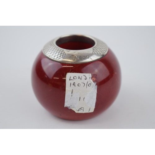 45 - Royal Doulton flambe match holder and striker, London 1907, 6.5cm diameter.