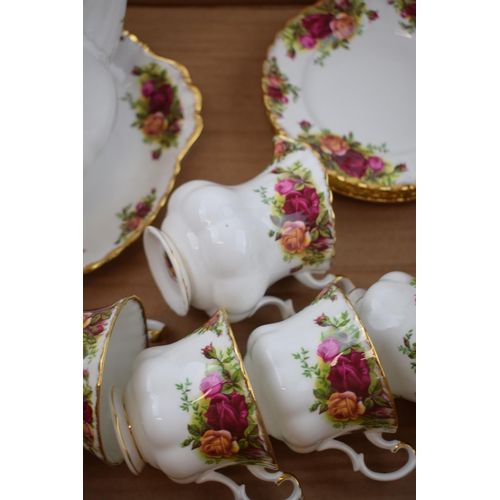 56 - Royal Albert Old Country Roses to include a teapot, 6 trios, a sugar bowl, a cake plate and a milk j... 