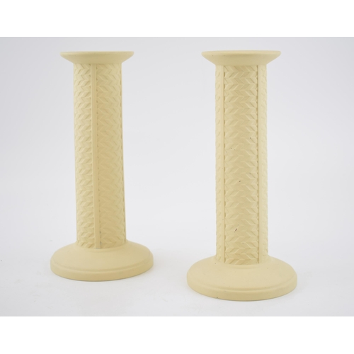 61 - A pair of Wedgwood yellow primrose cane candlesticks, 21cm tall (2).