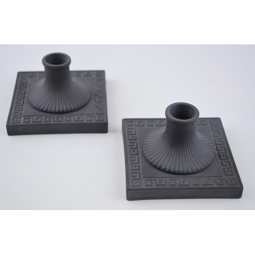 62 - A pair of Wedgwood black basalt square candlesticks, neoclassical design, 10.5cm wide (2).