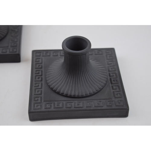 62 - A pair of Wedgwood black basalt square candlesticks, neoclassical design, 10.5cm wide (2).