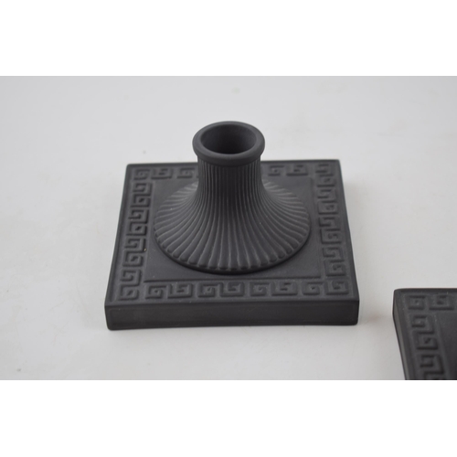 62 - A pair of Wedgwood black basalt square candlesticks, neoclassical design, 10.5cm wide (2).