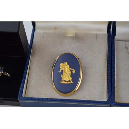 63 - Wedgwood jewellery to include a gold on blue cameo brooch in gilt frame, a gold on silver ring with ... 