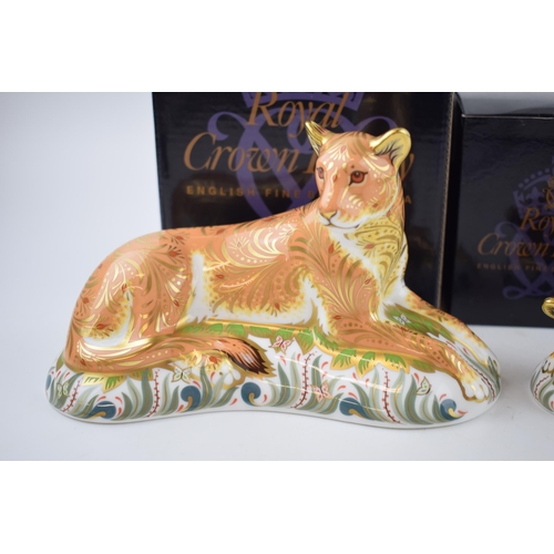 68 - Two Royal Crown Derby paperweights, Lioness with a Sleepy Lion Cub, gold stoppers and red printed ma... 