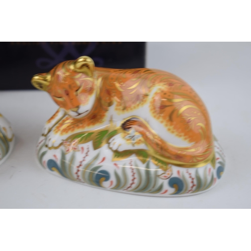 68 - Two Royal Crown Derby paperweights, Lioness with a Sleepy Lion Cub, gold stoppers and red printed ma... 