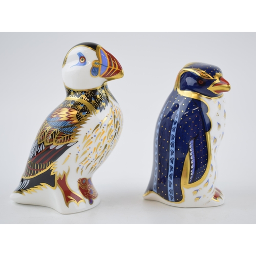 74 - A Royal Crown Derby paperweight, Puffin, date code for 1996 (LIX) and Rockhopper Penguin, 21st year ... 