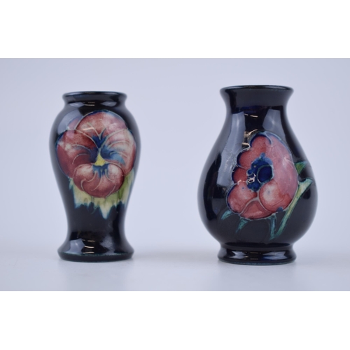 79 - A miniature pair of Moorcroft vases with floral design, 6cm tall (2).