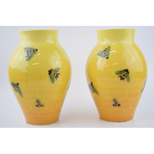 82 - A pair of Dennis China Works bulbous vases, by Sally Tuffin, with a honeycomb and bee design, 24cm t... 