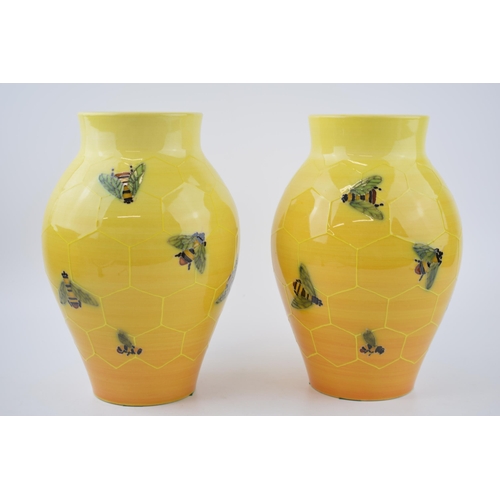 82 - A pair of Dennis China Works bulbous vases, by Sally Tuffin, with a honeycomb and bee design, 24cm t... 