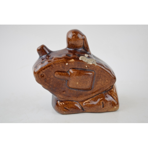 201 - Stoneware treacle-glazed money box in the form of WWI tank. Height 9.5cm.