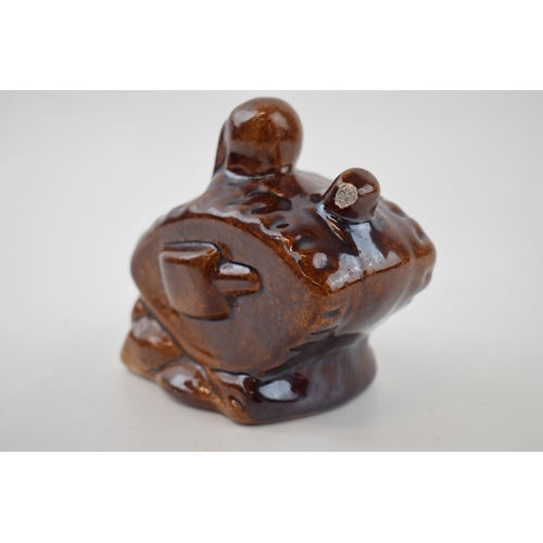 201 - Stoneware treacle-glazed money box in the form of WWI tank. Height 9.5cm.