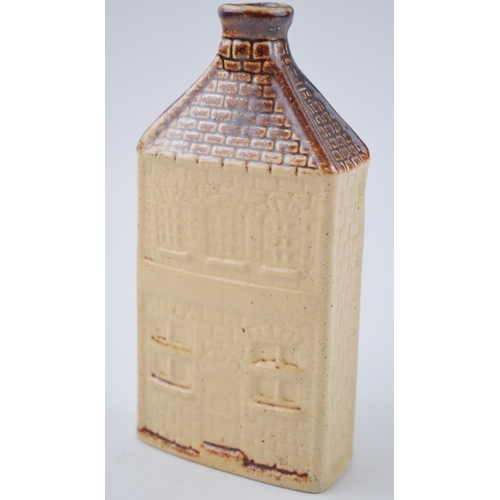 202 - Stoneware bottle in the form of house, chimney rises to form bottle neck. Inscribed E R to base. Hei... 