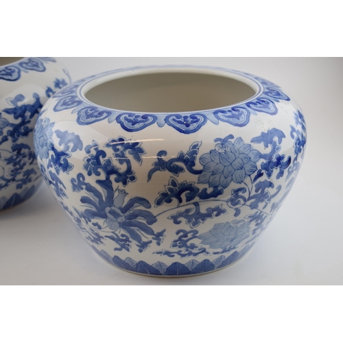 205 - A pair of late 20th century Oriental style jardinieres, blue and white foliage, 31cm diameter (2).